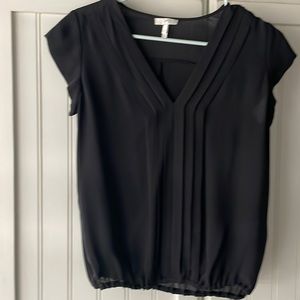Black XS Joie silk blouse. It’s 100% silk and it is in excellent condition
